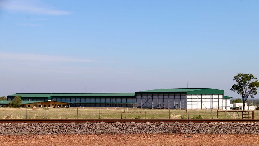 A picture of the abattoir, which has a green roof, from outside.