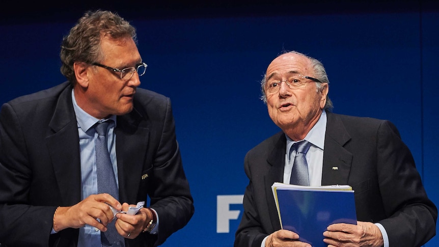 FIFA president Sepp Blatter (R) speaks to FIFA secretary general Jerome Valcke in March 2015.