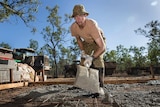 Corporal Jason Neumann helps lay concrete with the Army Aboriginal Community Assistance Program in far north Queensland.