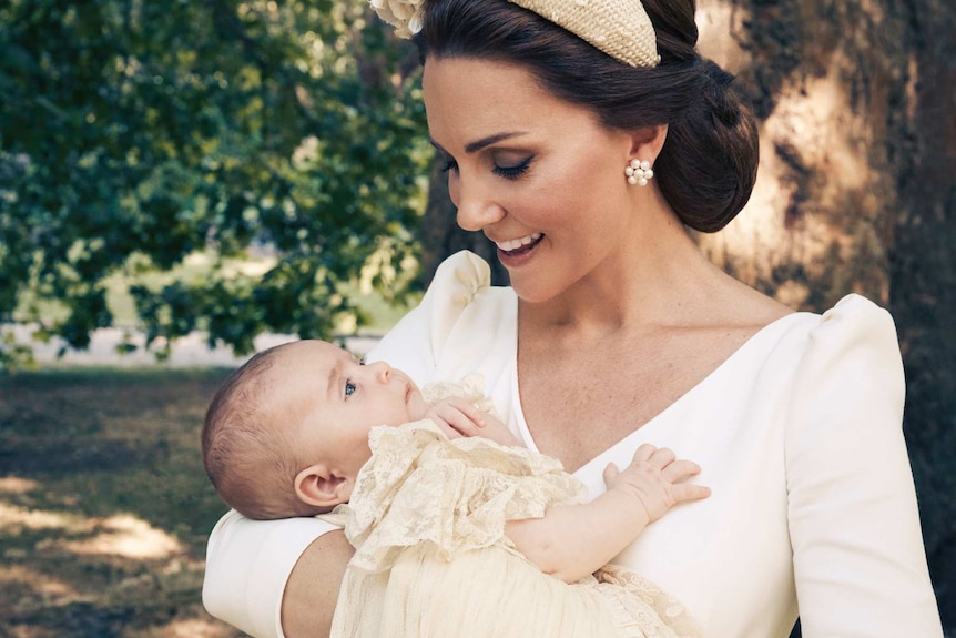 Kate, the Duchess of Cambridge, holds Prince Louis in an official photo to mark the christening.
