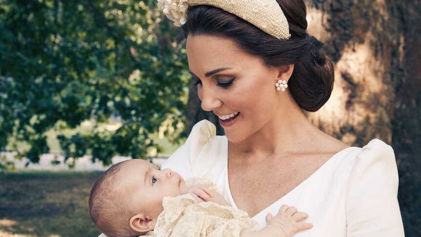 Kate, the Duchess of Cambridge, holds Prince Louis in an official photo to mark the christening.