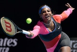 Serena Williams reaches out to a play a forehand at Melbourne Park during the Australian Open
