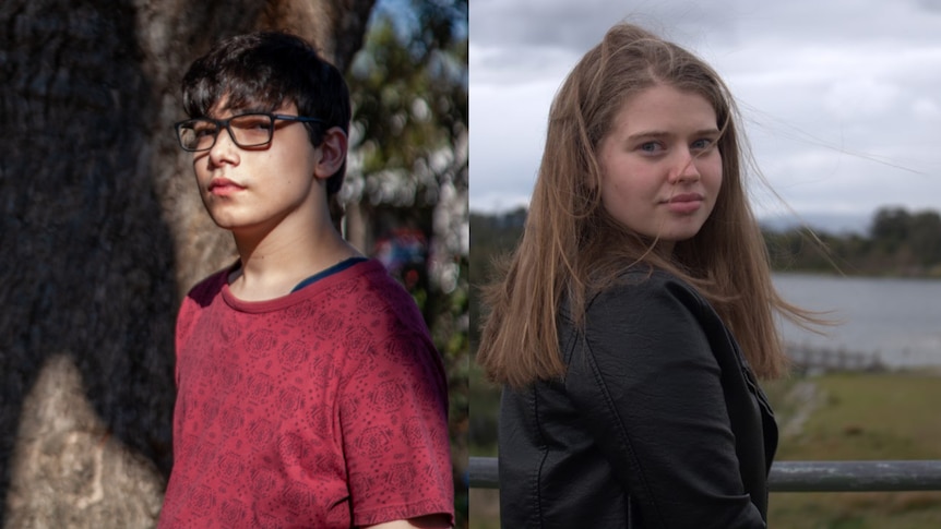 A boy in a red shirt and glasses looks to the camera.A girl in a black leather jacket mirrors him.