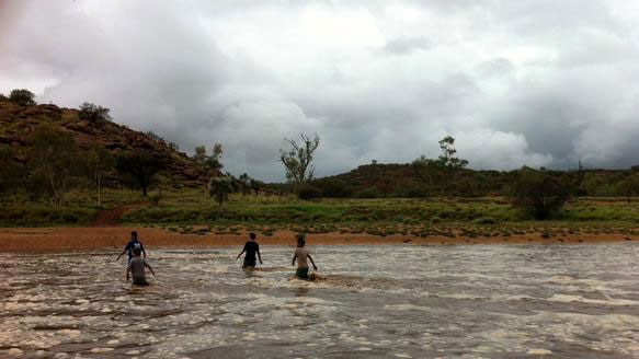 Children playing in the Todd River near Alice Springs