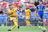 Adam Taggart (L) scores for Perth Glory against Newcastle Jets in Newcastle on January 15, 2017.