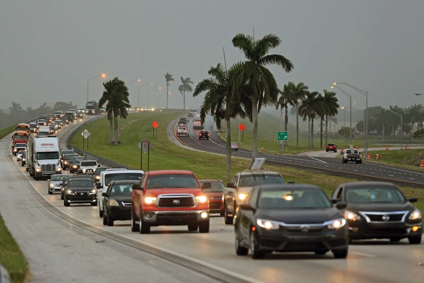 Bumper-to-bumper traffic drives along a Florida highway.