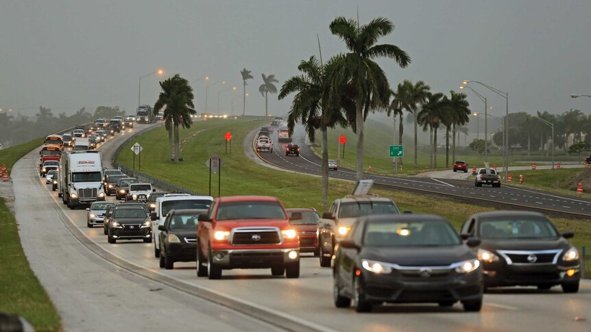Bumper-to-bumper traffic drives along a Florida highway.