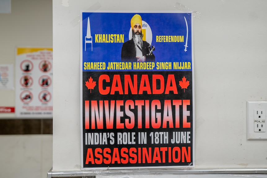 A sign says 'Canada Investigate India's role in 18th June assassination'