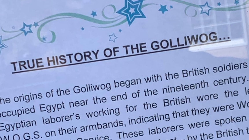 Sign defending the 'true history of the golliwog'.