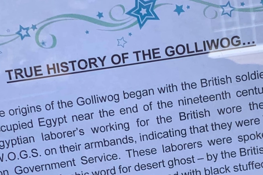 Sign defending the 'true history of the golliwog'.
