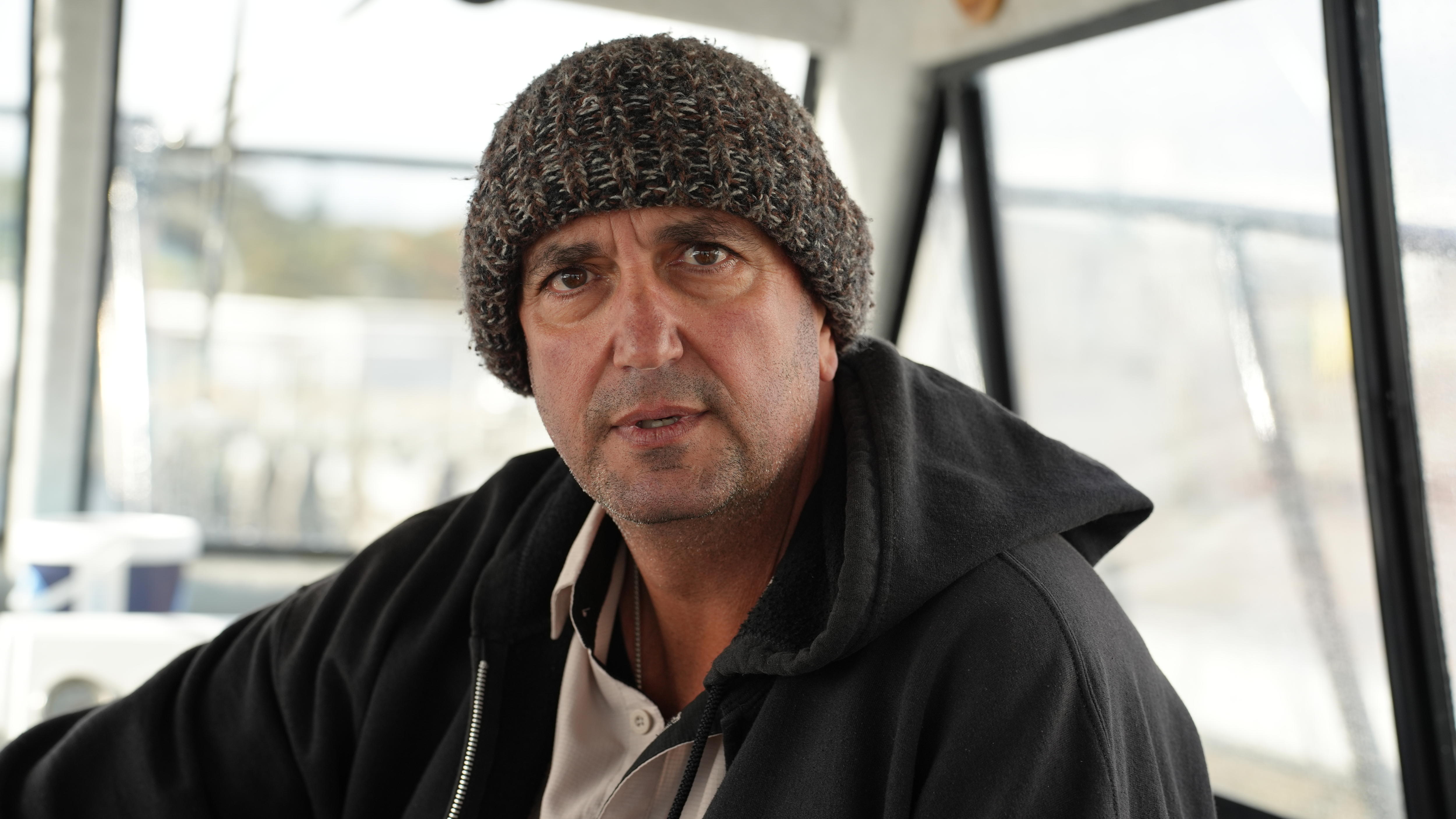 A close of man with a beanie.