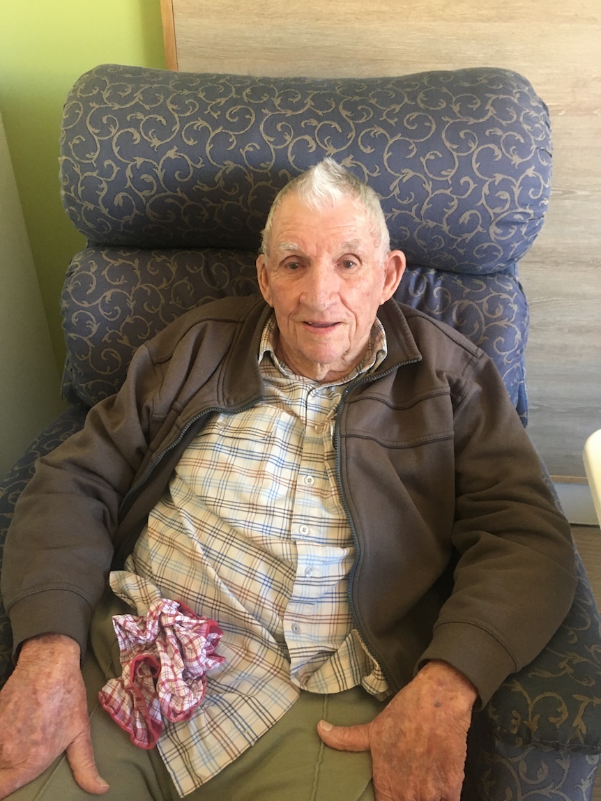 Brian Carroll, 90-year-old nursing home resident in Parkes, sits on chair