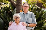 Kay and Bob Lockley standing together in their garden.