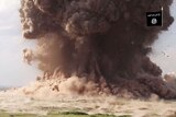 A cloud of dust following Nimrud being blown up by Islamic State