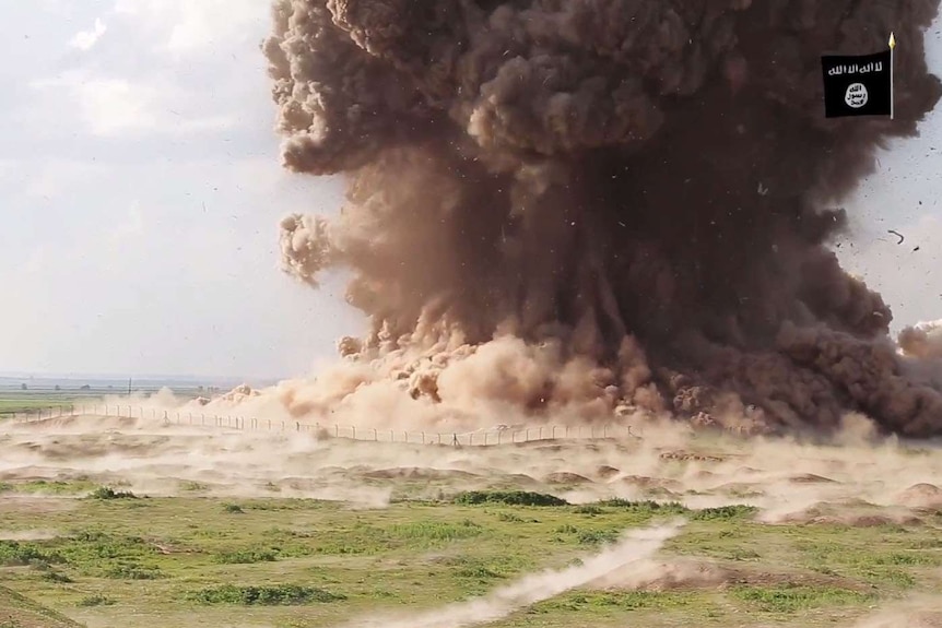 A cloud of dust following Nimrud being blown up by Islamic State