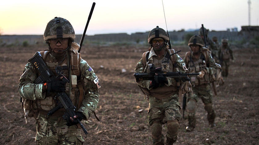 Soldiers from 1st Battalion the Royal Gurkha Rifles walk during a patrol in Nahr-e Saraj, Helmand.