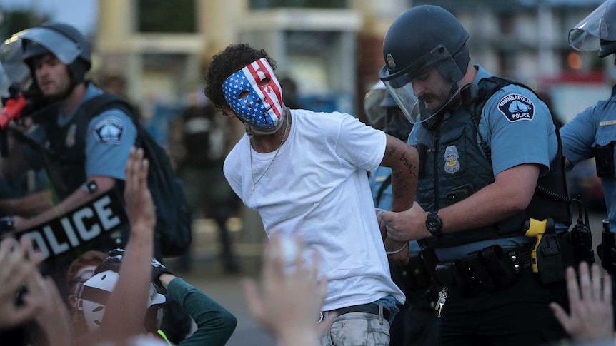 A demonstrator is arrested during a protest in Minneapolis
