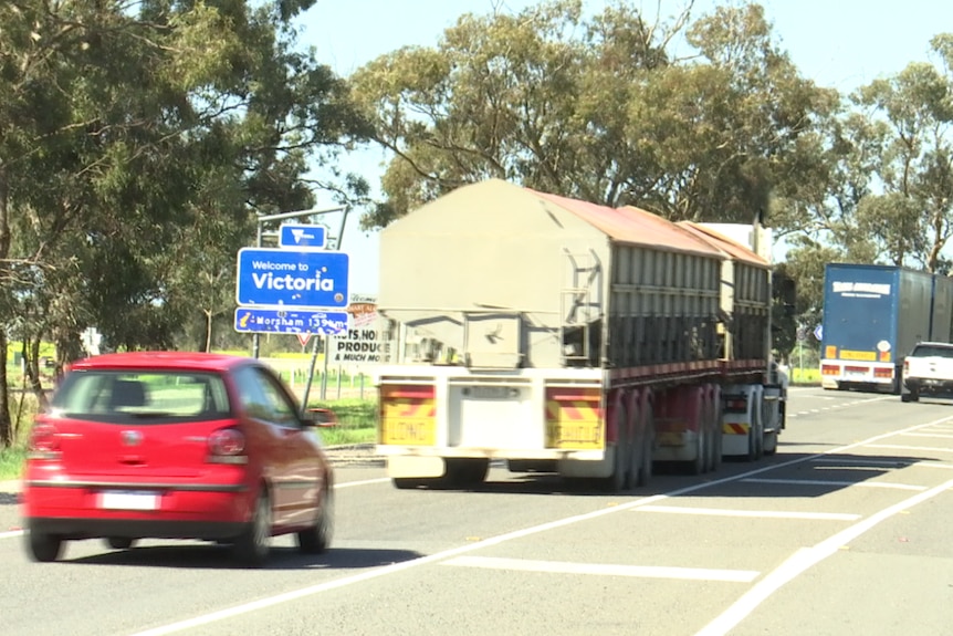 A truck and several cars on a road