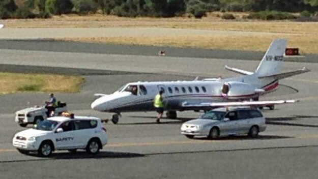 The Learjet limps along runway