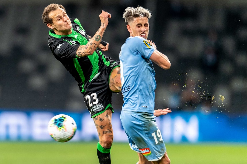 Alessandro Diamanti kicks in the air towards a Melbourne City player