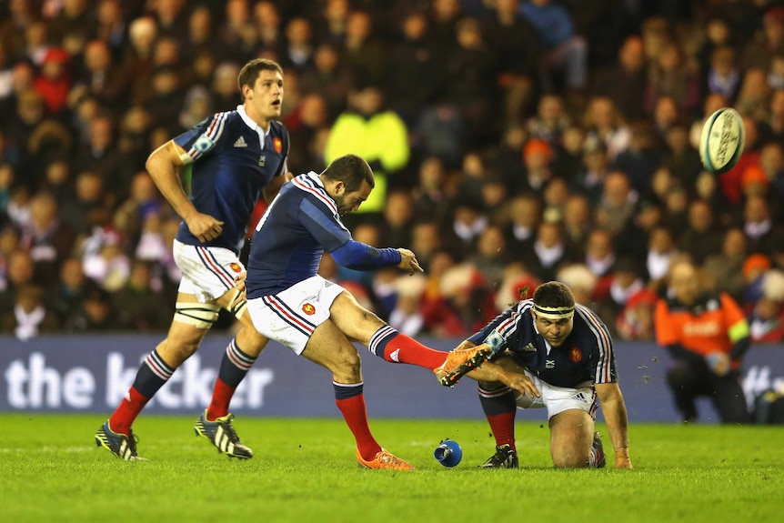 France's Jean Marc Doussain kicks a last-minute penalty to win the match against Scotland.