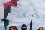 Opposition: Libyan rebels head to the front line of fighting with Gaddafi's forces.
