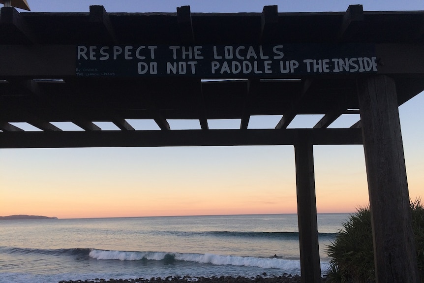 A sign imploring visitors to the Lennox Head point surf break to 'respect the locals, do not paddle up the inside'.