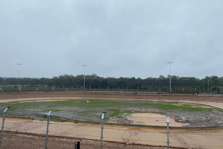 A speedway track covered in water