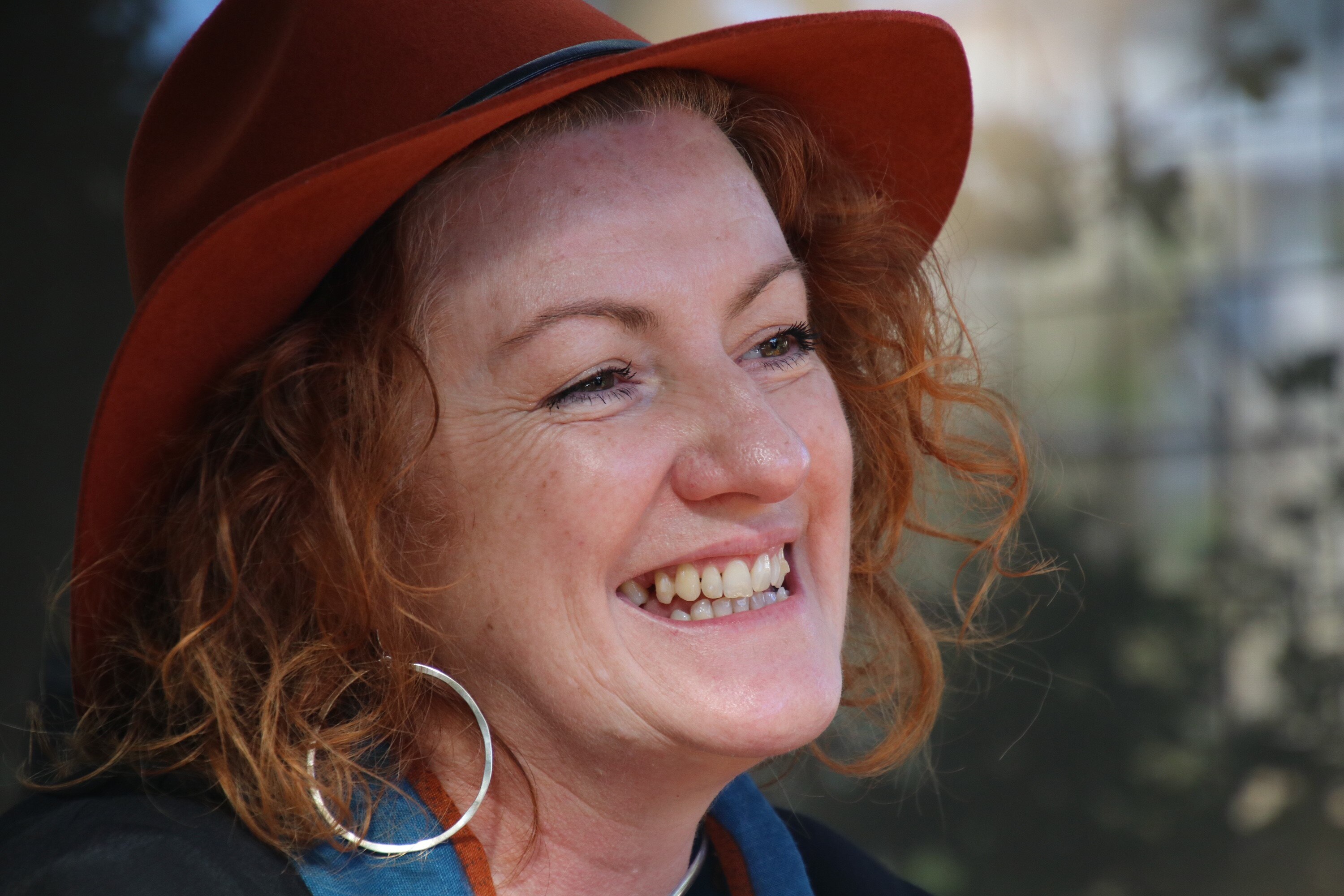 Head shot of Harry Deluxe with a broad smile.