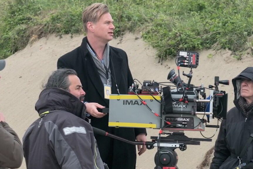 Christopher Nolan lines up the cameras on the beach while filming Dunkirk.