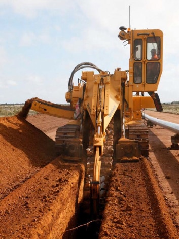 A trench is dug during the construction phase of a gas pipeline.