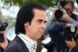 Screenwriter Nick Cave poses at the Lawless photocall during the 65th Annual Cannes Film Festival.
