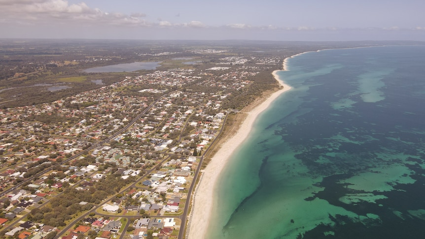 Aerial view of the city of Busselton, the beach, and the Indian Ocean.