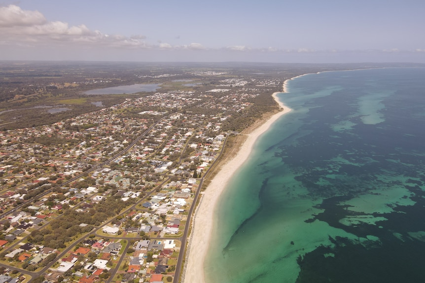 Aerial view of the city of Busselton, the beach, and the Indian Ocean.