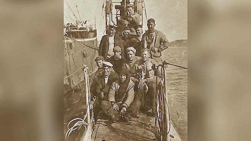 Photo of men on submarine deck