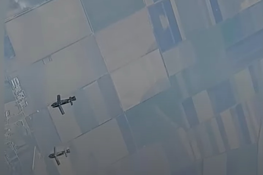 Aerial view of glide bombs soaring in the sky after being dropped from a fighter jet.