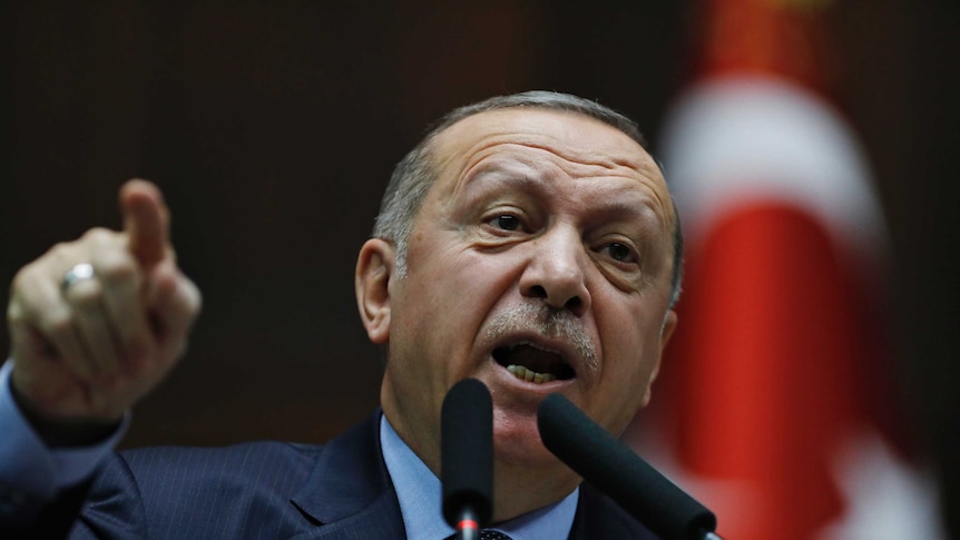 Turkey's President Recep Tayyip Erdogan gestures as he delivers a speech.
