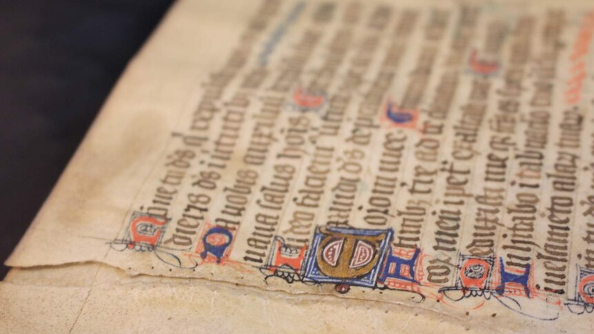 An historic tear repair on one of the Psalter's pages.