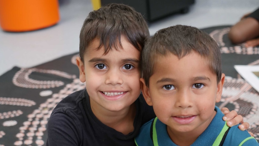 Young Indigenous pre-primary students smile at the camera