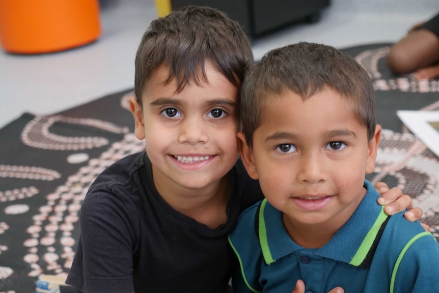 Young Indigenous pre-primary students smile at the camera