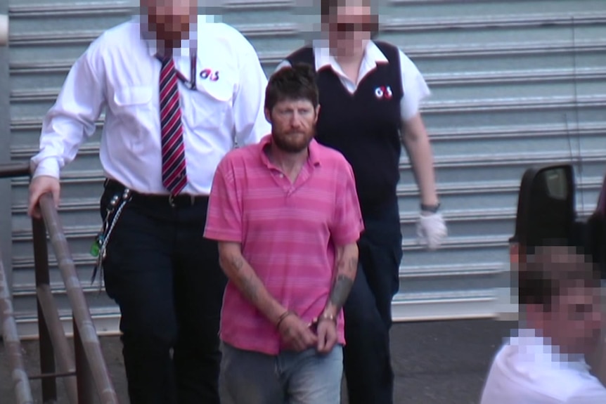 Gavin Scott Skinner accompanied by court officers before his conviction for murder.