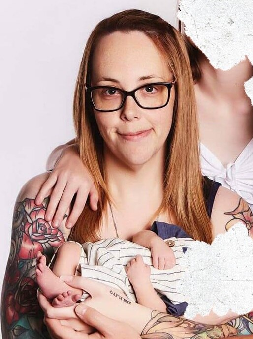 A woman in a family photo with other faces blurred.