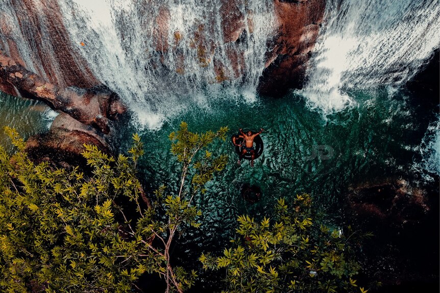 This picture captures the birds-eye view of his two friends below the Awawi Falls in the West Sepik Province.