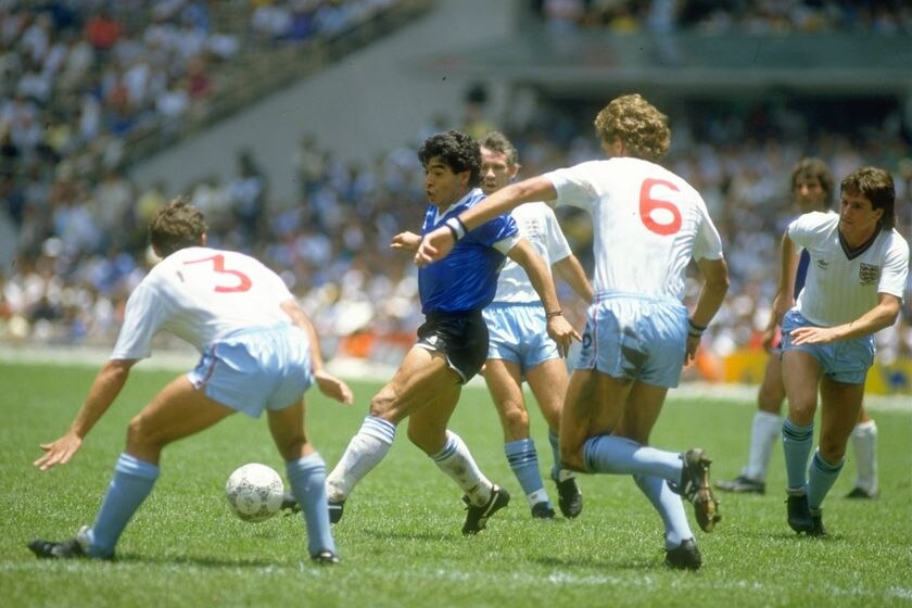 Diego Maradona takes on Sansom and Terry Butcher