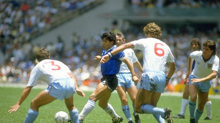 Diego Maradona takes on Sansom and Terry Butcher