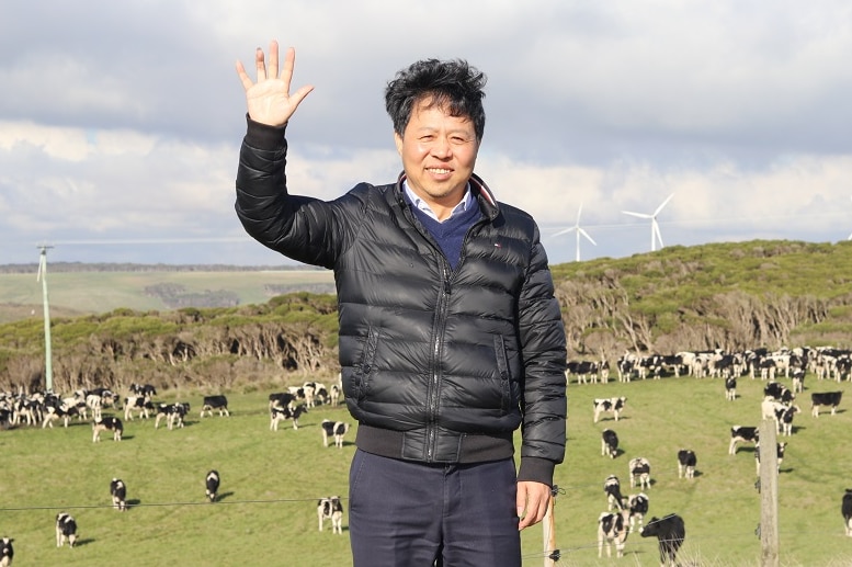 Mr Lu waves to the camera at his Cape Grim property.