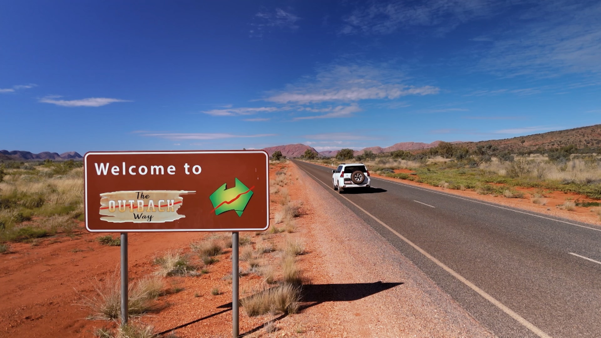 A car on a section of the Outback Way route through central Australia.