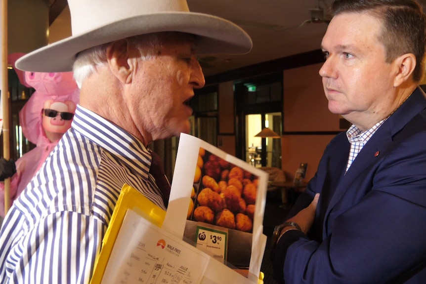 Politicians Bob Katter and Ross Cadell confront each other.