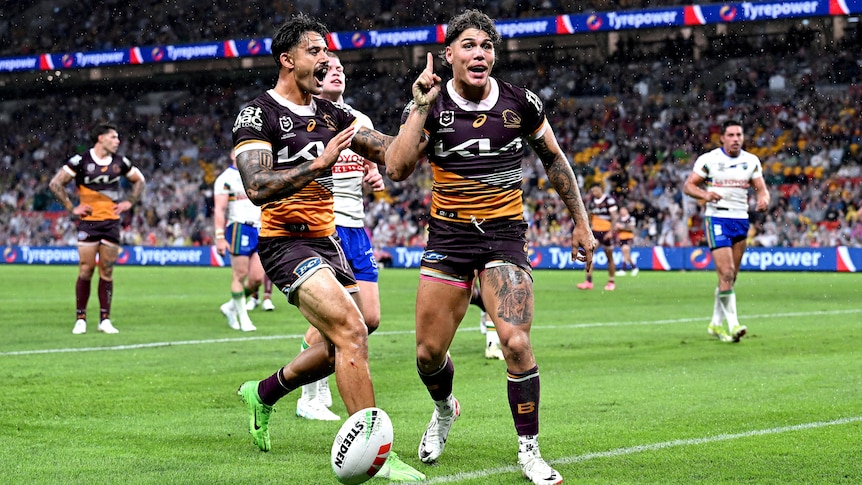 Reece Walsh holds up a finger as Brisbane Broncos teammate Jesse Arthars runs to hug him after a try against the Raiders.