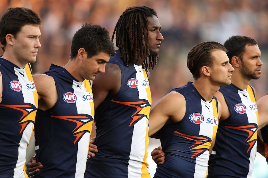 West Coast Eagles arm in arm before preliminary final